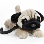 Pug Dog lying with lead, soft toy, stuffed animal